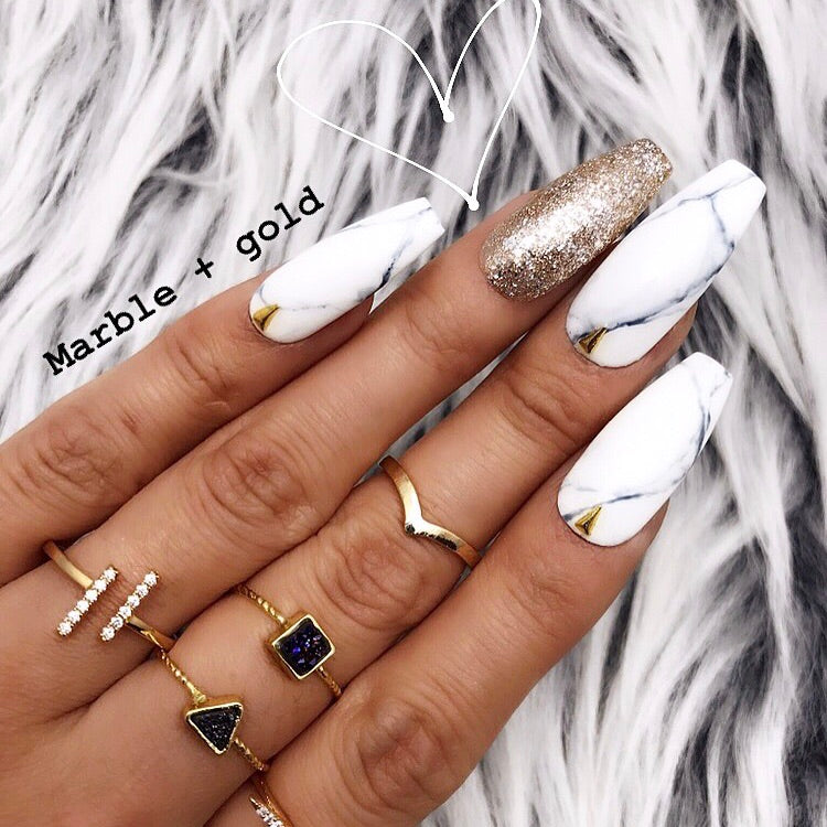 black white and gold nails